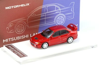 1:64 MOTORHELIX Mitsubishi Lancer Evolution IV Metallo Red + Cerchi Hec Expo - Immagine 1 di 4