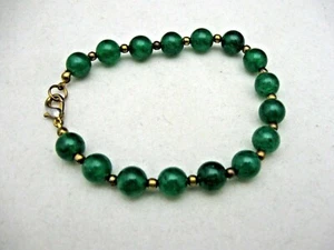 WOMAN'S BRACELET WITH GREEN GLASS BEADS AND GOLD SPACERS. - Picture 1 of 5