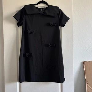 Mädchen schwarzes Kleid mit Schleifen Gr. L 12 - Bild 1 von 2