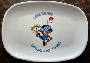 Piatto immagine Copa de Oro Uruguay 1980 con mascotte Charrúa da appendere al muro - Foto 1 di 6