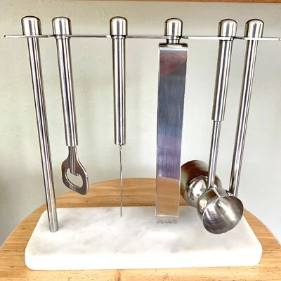 Juego de herramientas de barra de mármol blanco y acero inoxidable abridor pinzas recogedor de cerezas Foto 1 de 4