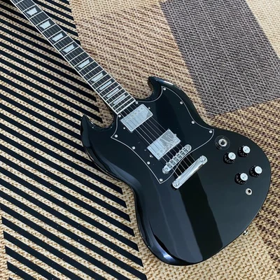 Guitarra SG Cuerpo Caoba Negro Golpeador Grande Diapasón Palisandro Fábrica Foto 1 de 4