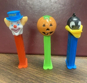 3 Stück - Vintage PEZ Spender Clown, Kürbis, Ente - Bild 1 von 4