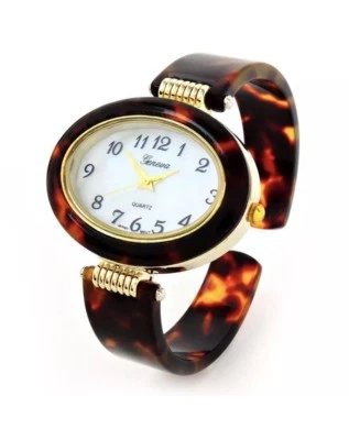 Reloj brazalete ovalado con correa de acrílico acabado dorado tortuga para mujer Foto 1 de 4