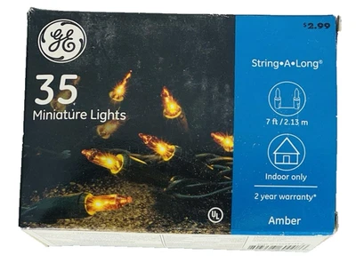 Cadena de mini luces amarillas ámbar 35 unidades alambre verde cadena GE a lo largo 7' iluminado incand Foto 1 de 4