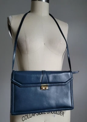 BOLSA TIRACOLO/EMBREAGEM VINTAGE MORRIS MOSKOWITZ COURO MARINHO com CINTA AJUSTÁVEL - Imagem 1 de 4