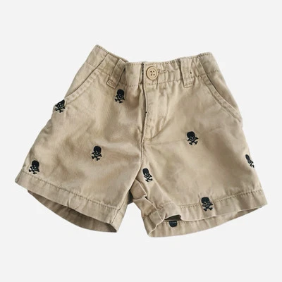 Place Casual Bronceado Beige Pantalones Cortos Niños 9-12 Mo Bolsillo Lateral Trasero Calavera Hueso Estampado Foto 1 de 4
