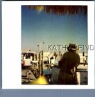 FOUND COLOR POLAROID U_7691 MAN IN HAT FROM BEHIND ON DOCK,BOATS