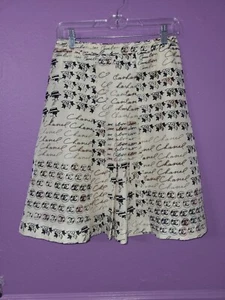 Chanel Printed Pleated Ivory 100% Silk Skirt w/her signature and camelia repeats - Picture 1 of 3