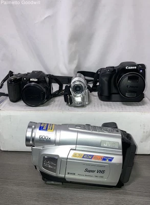 Lot of 4 Cameras PARTS ONLY - image 1 of 4