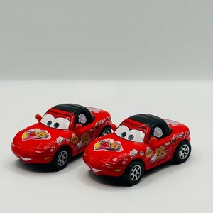 Disney Pixar Cars - MCQUEEN FAN RED MIA & TIA 2008 - 1:55 Diecast - Picture 1 of 2