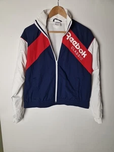 Chaqueta cortavientos Reebok clásica talla pequeña Reino Unido roja blanca azul bolsillos con cremallera completa - Imagen 1 de 9
