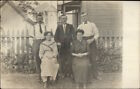Family Posing In Yard - Visible Homes - New Bedford Area Written On Back Rppc