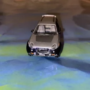 REAL TOY ISUZU VEHICROSS 4 X 4 BLACK AND SILVER 7CM X 3CM GOOD CONDITION - Picture 1 of 5