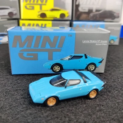 AUTO MINI GT LANCIA STRATOS HF STRADA AZZURO CHIARO 1975 1:64 NUOVA SCATOLA - Immagine 1 di 4