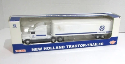 Semirremolque fundido a presión Ertl New Holland 1995 1/64 345 Foto 1 de 3