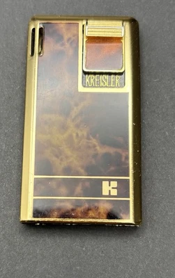 ENCENDEDOR DE BOLSILLO DELGADO BUTANO ENCHAPADO EN TONO DORADO Y ELEGANTE KREISLER de colección Japón Foto 1 de 4