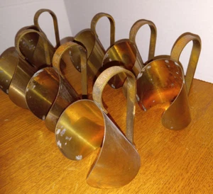 ¿JUEGO DE 7 PORTAVELAS/MANIJAS DE BOTELLAS DE LATÓN? - Imagen 1 de 6