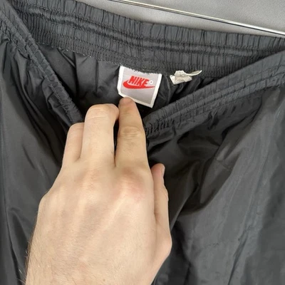 Pantalones de chándal vintage Nike cortavientos para hombre XL de nailon con cremallera pantalones negros Swoosh Foto 1 de 4