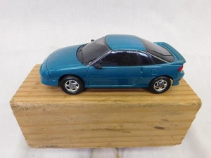 NUEVO AMT ESCALA 1/25 1991 GEO STORM GSI VERDE AZULADO MODELO PROMOCIONAL ERTL - Imagen 1 de 7