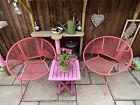 Two Homebase Acapulco round pink pvc rattan garden chairs
