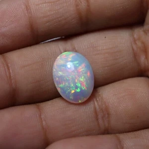 4,2 kt 13,7 x 10,4 mm natürlicher AAA auffälliger Multi Feuer äthiopischer Opal ovaler Cabochon - Bild 1 von 10