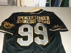 NIKE ATLANTA BRAVES SPENCER STRIDER STRIKEOUT SQUAD BLACK & GOLD JERSEY SIZE 52 - Picture 1 of 5