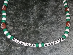 Michigan State Spartans MICHIGAN CHEATED Football Bead Handmade Necklace - Picture 1 of 3