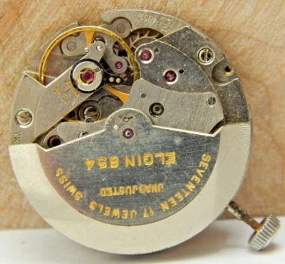 Vintage Elgin 854 17 jewel automatic wrist watch movement with crown stem combo - Image 1 of 4