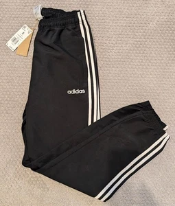 Neu mit Etikett Adidas Herren SMALL schwarz sportliche Jogginghose Windhose Trainingshose - Bild 1 von 2