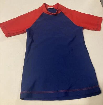 Top protector contra erupciones Baby Cottons para niños pequeños talla 4 azul y rojo manga corta usado.  Foto 1 de 4
