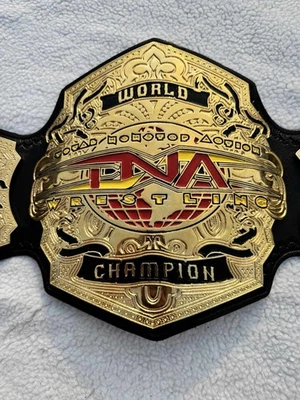Cinturón réplica Campeonato Mundial de Lucha Peso Pesado TNA 4mm Zinc Tamaño Adulto Foto 1 de 4