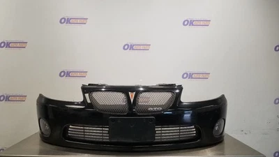 06 PONTIAC GTO FRONT BUMPER ASSEMBLY BLACK WITH GRILLES  - Изображение 1 из 4
