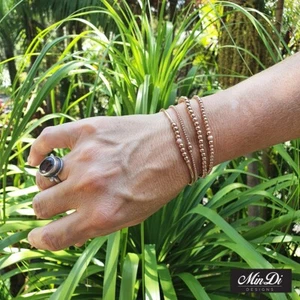 Juego de 4 pulseras elásticas hechas a mano con cuentas rellenas de oro rosa de 14K. - Imagen 1 de 10