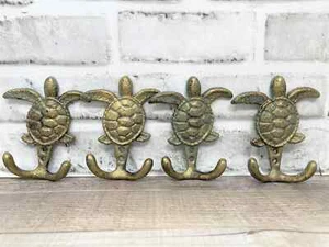 Juego de 4 ganchos de abrigo de tortuga marina de hierro fundido rústicos de 4,5" de aspecto vintage para cabaña habitación de barro - Imagen 1 de 6