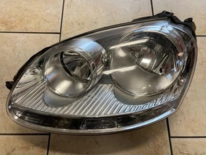 VW Golf 5 V año 07 orig. Faro izquierdo TYC 20A318 - Imagen 1 de 17