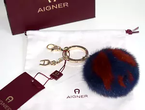 AIGNER Taschenschmuck Anhänger - Peace Pelz blau - terrakotta Neu - Bild 1 von 6