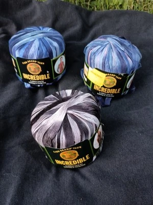 Lion Brand Incredible Yarn Ribbon 2 Blue Shades 1 Accent On Black - Image 1 of 4