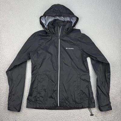 Chaqueta cortavientos Columbia para mujer pequeña negra con capucha ligera de nailon Foto 1 de 4
