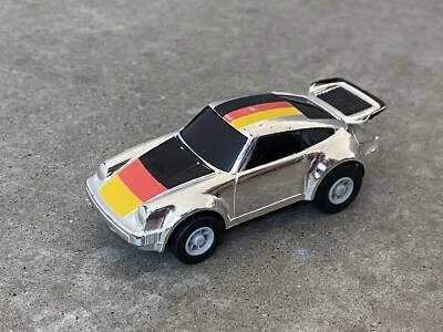 Vintage Ratchet Racers Porche 930 Tomy Toy Wind Up Car Chrome - Image 1 of 4