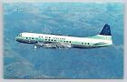 Air New Zealand Jet Prop Electra Airliner Airplane in Flight Postcard
