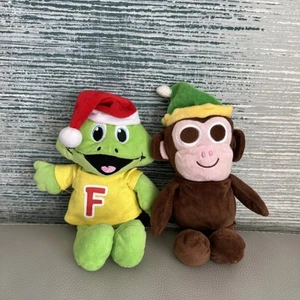 CADBURYS FREDDIE FROG AND BUTTONS MONKEY SOFT TOYS WEARING SANTA HATS - Picture 1 of 10