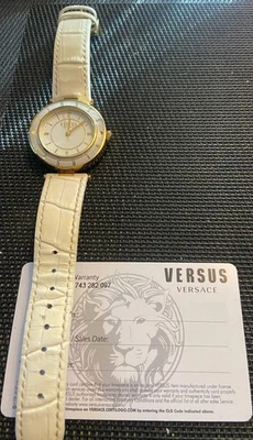 Cream leather band Versus by Versace leather band watch.  Cream face with gold. - Image 1 of 2