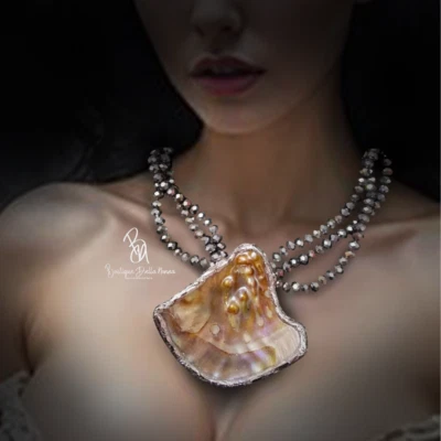 ECCENTRIC SILVER PLATED SEA SHELL NECKLACE - Image 1 of 3