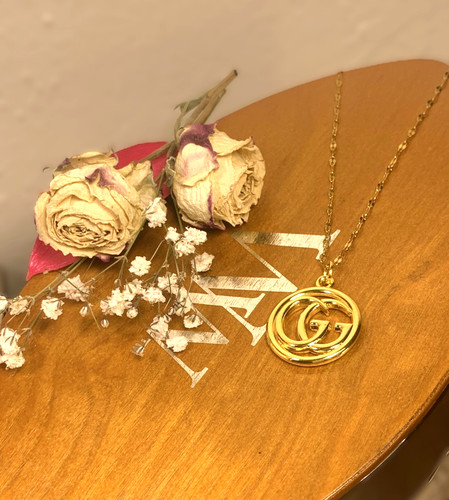 Collana girocollo Gucci GG oro ad incastro doppia sfera G catena a levetta