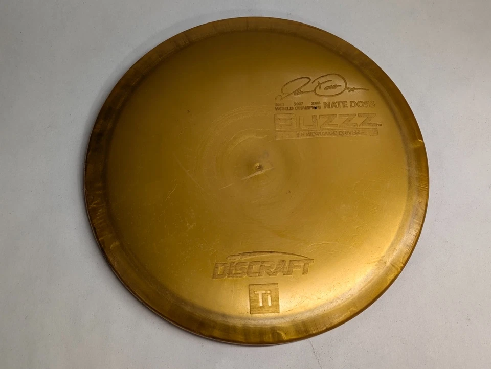 Discraft Ti BUZZZ Midrange Driver Disc Golf Titanium 178g Gold Nate Doss 3x - Image 1 of 4