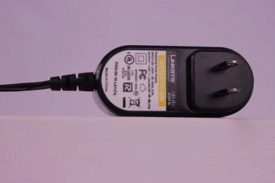 LINKSYS Switching AC POWER SUPPLY Adapter AD12V/1A-SW | ENG-09-05-35585A - Image 1 of 3