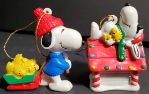 2 Peanuts Ornaments - Snoopy & Woodstock on Doghouse & Snoopy pulling Sleigh - Picture 1 of 10
