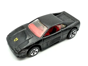 Ferrari 348 1990 Hot Wheels negro metálico con interior rojo 1/64 - Imagen 1 de 5