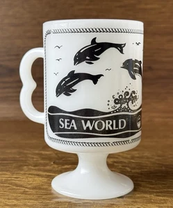 Taza de café con pedestal de vidrio de leche vintage Sea World Whale Dolphins mango B - Imagen 1 de 9